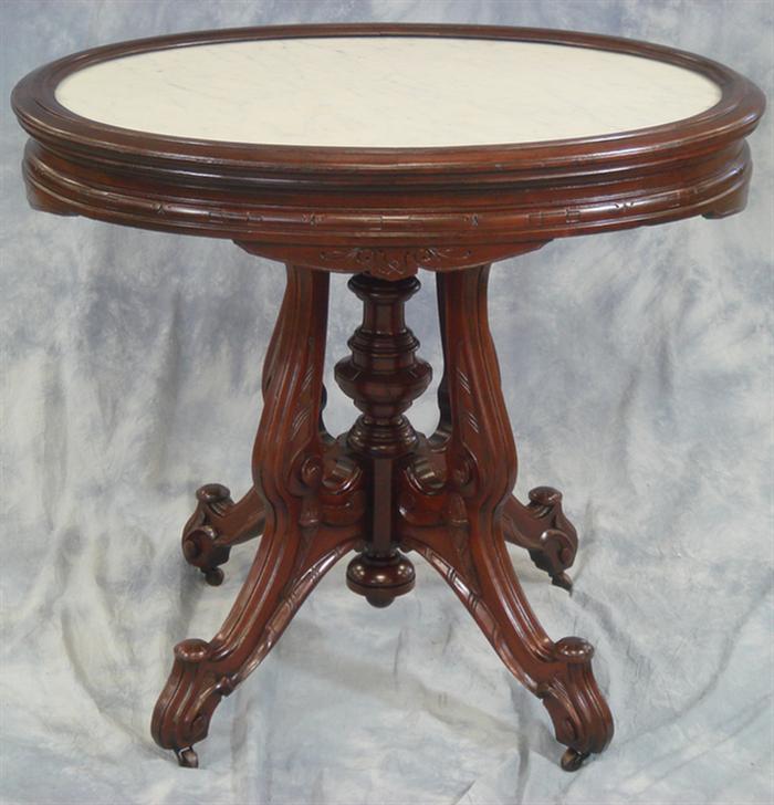 Appraisal: Oval carved walnut Victorian marble top table with picture frame