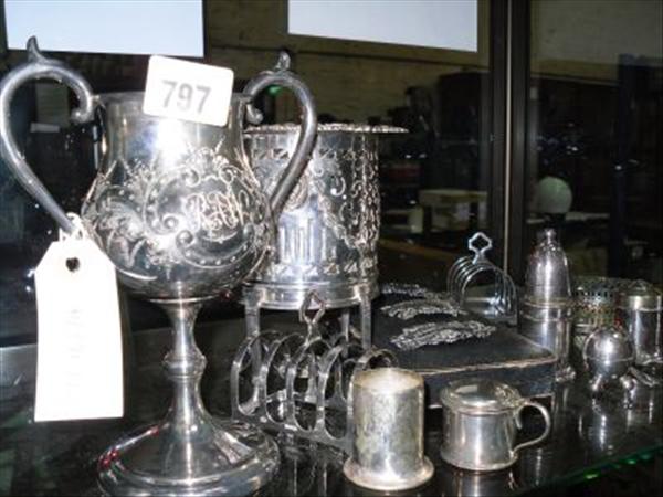 Appraisal: A hallmarked silver mustard pot a pair of silver toast