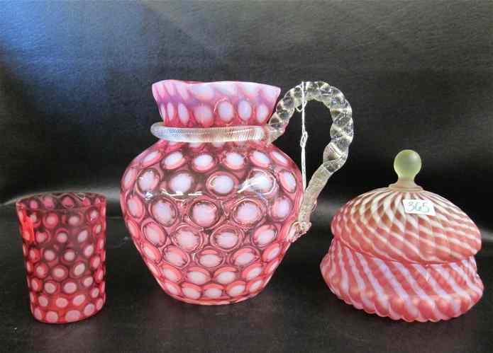 Appraisal: THREE CRANBERRY ART GLASS PIECES opalescent coin dot pitcher with