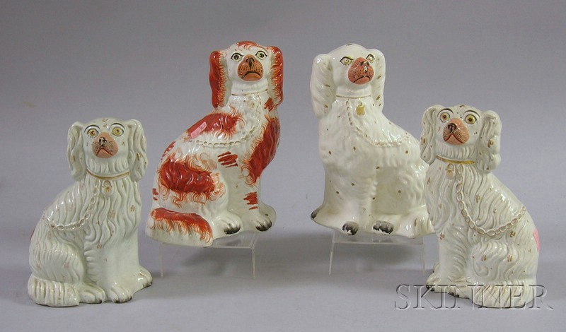 Appraisal: Four Staffordshire Seated Spaniels including a pair ht to in