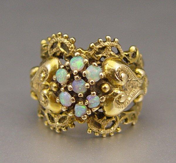 Appraisal: FILIGREE K OPAL RING Ornate K yellow gold ring contains