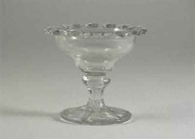 Appraisal: A glass sweetmeat dish the ogee bowl with a cog