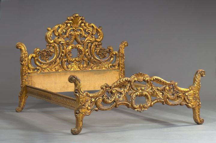 Appraisal: Elaborate Rococo-Style Carved and Gilded Bedstead the headboard with a