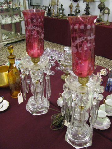 Appraisal: Pair of Cut Crystal Hurricane Lamps etched cranberry globes large