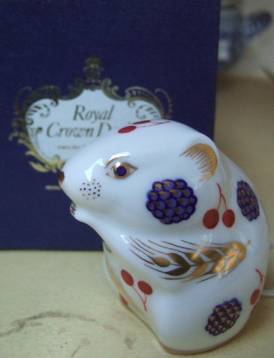 Appraisal: A Royal crown Derby imari decorated paper weight moulded as