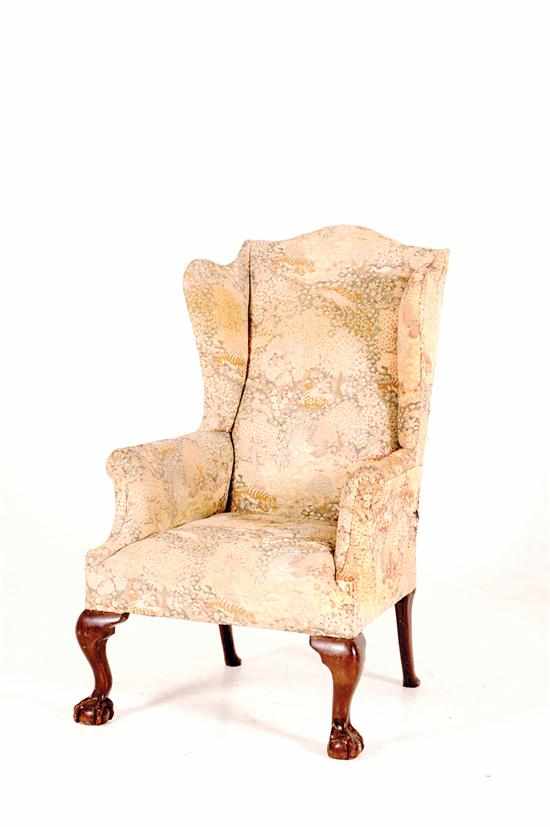 Appraisal: Chippendale style mahogany wingback armchair circa shaped crest and wings