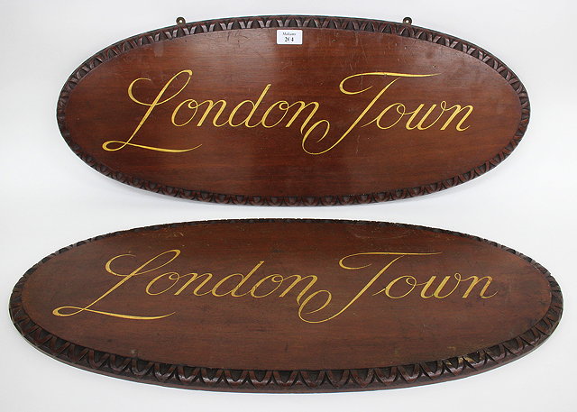 Appraisal: A PAIR OF MAHOGANY PLAQUES each inscribed in gold script