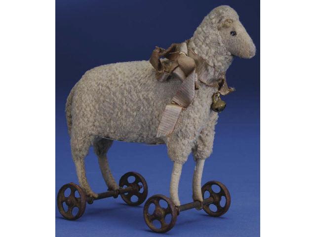 Appraisal: Early Miniature Steiff Sheep on Wheels Germany ca wool fleece