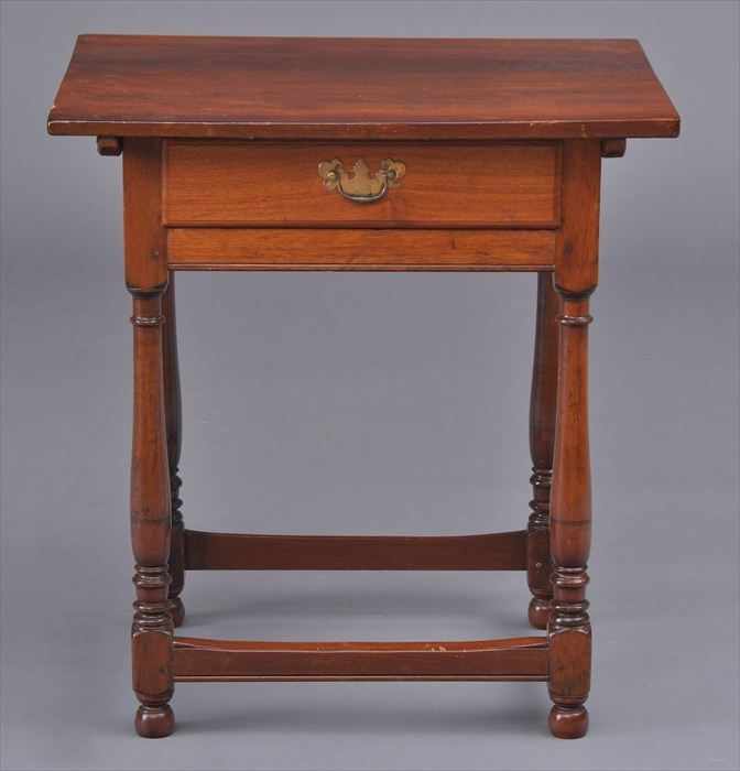 Appraisal: AMERICAN WALNUT TAVERN TABLE The rectangular top above a frieze