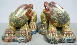 Appraisal: Two Chinese th century carved polychrome painted Dogs of Fo