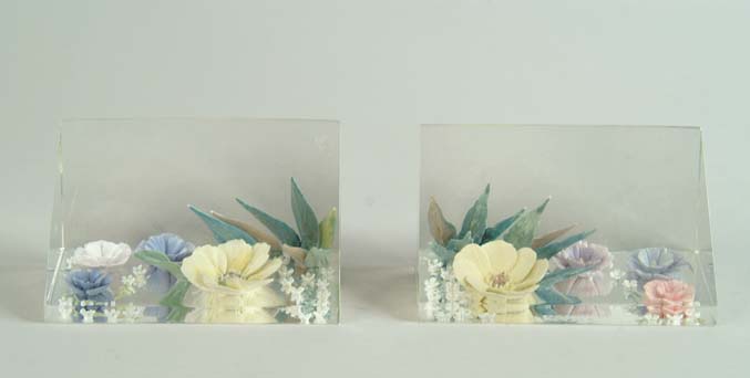 Appraisal: PAIR OF DOROTHY DOUGHTY ACRYLIC AND PORCELAIN BOOKENDS Triangular clear