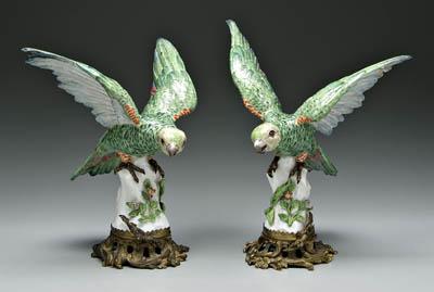 Appraisal: Pair ormolu mounted porcelain parrots with spread wings perched on