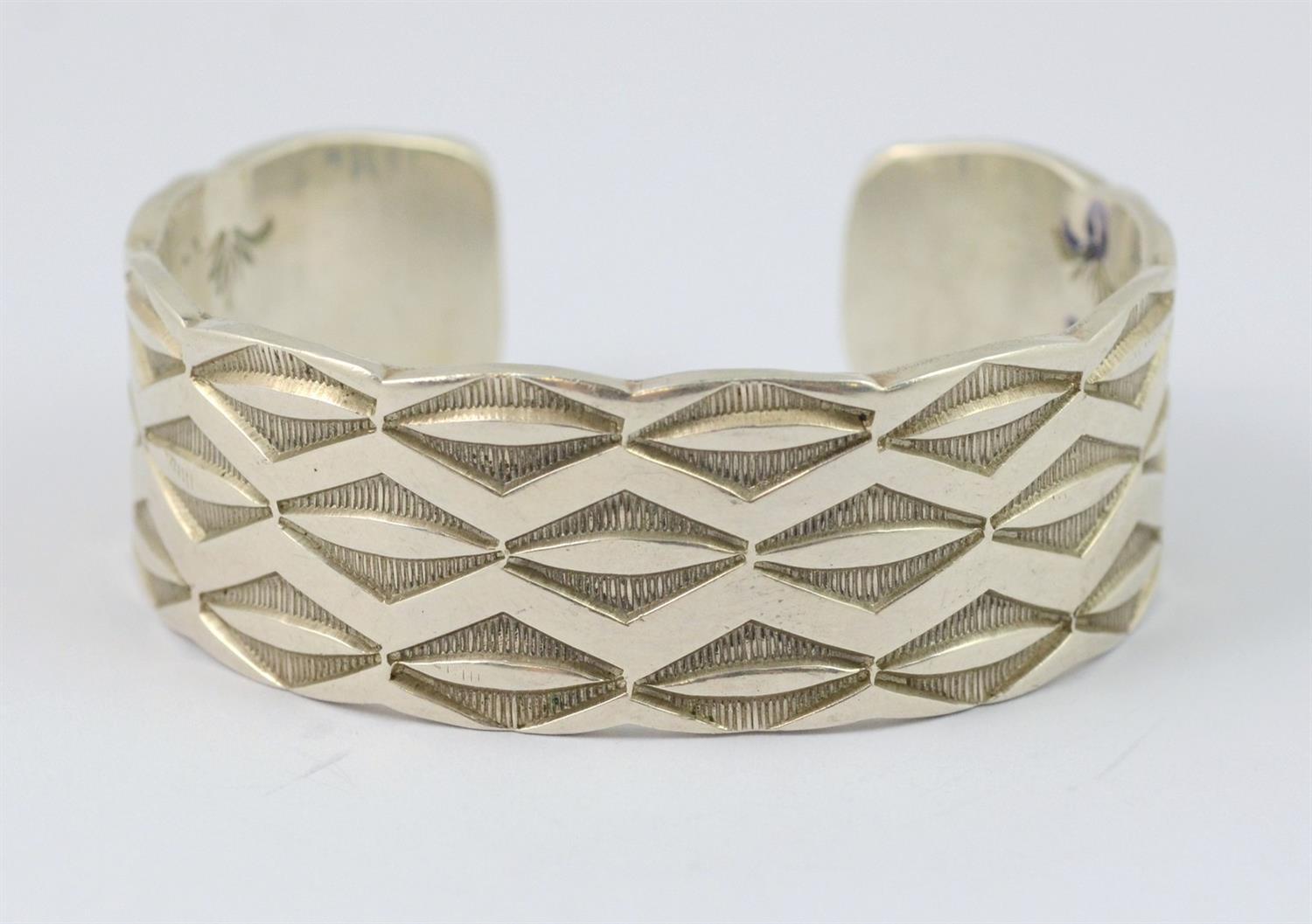 Appraisal: Raymond Yazzie Navajo sterling stampwork cuff bracelet with inside outside