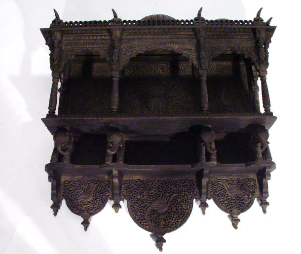 Appraisal: Indian ebonised hardwood wall hanging shelf with three dome tops