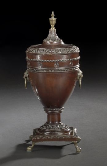 Appraisal: Edwardian Brass-Mounted Carved Mahogany Covered Cup first quarter th century