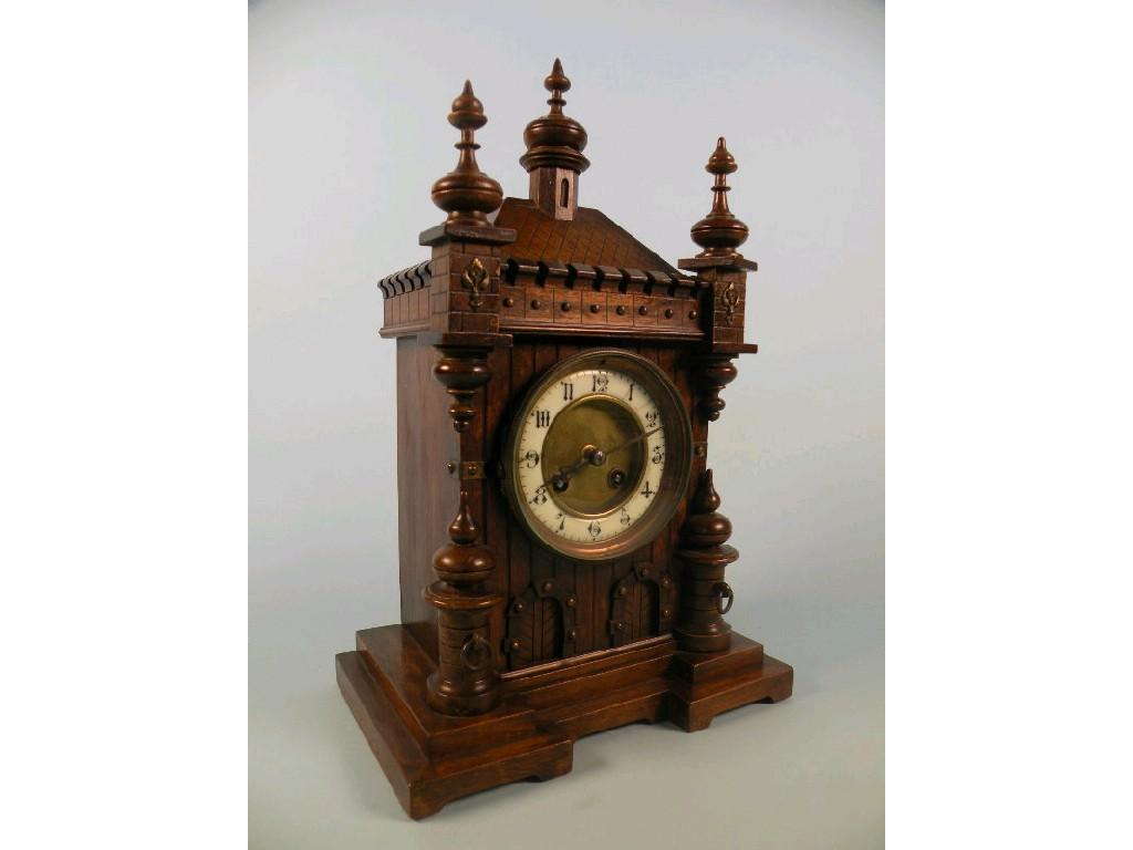 Appraisal: A thC German walnut mantel clock in the form of