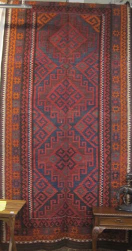 Appraisal: PERSIAN KILIM FLATWEAVE CARPET hand woven in an overall geometric