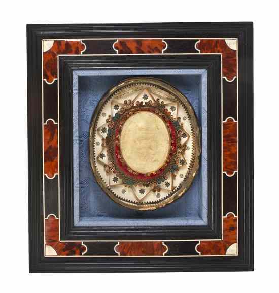 Appraisal: A Continental Pressed-Wax Medallion of oval form set in an