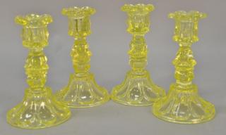 Appraisal: Set of four canary yellow sandwich glass candlesticks th century