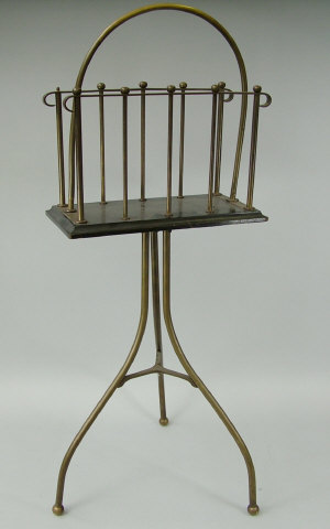 Appraisal: A tubular brass twin division magazine rack on tripod base