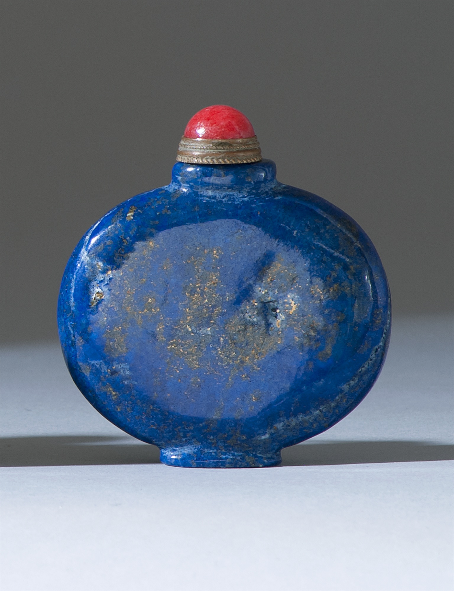 Appraisal: LAPIS LAZULI SNUFF BOTTLE th CenturyIn flattened ovoid form Height