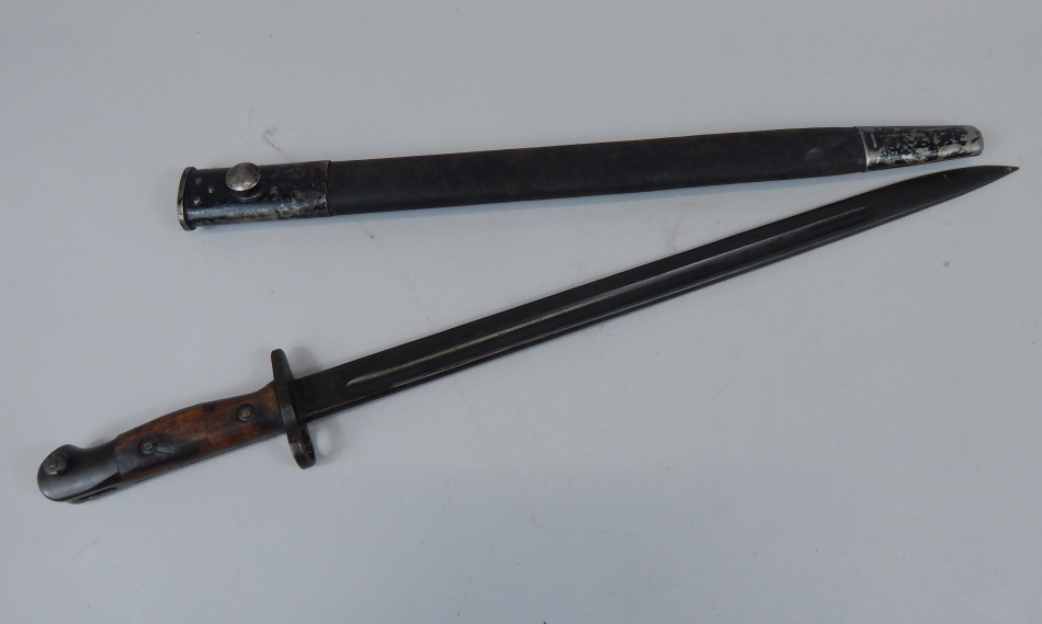 Appraisal: An early thC bayonet the blade indistinctly stamped with wooden