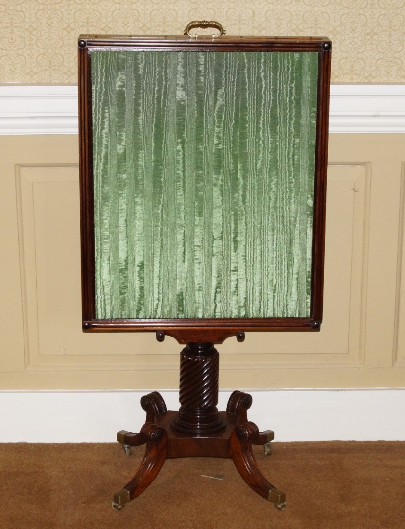 Appraisal: A Regency mahogany adjustable fire screen with green watered silk