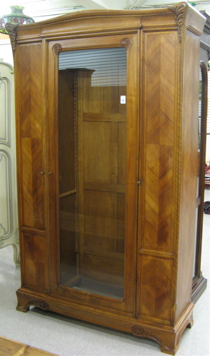 Appraisal: ART NOUVEAU WALNUT VITRINE French c the front centering a