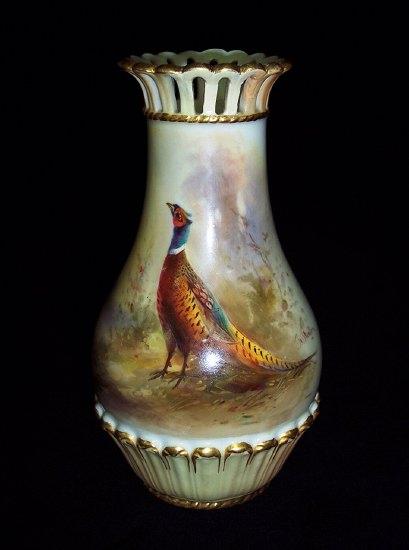 Appraisal: A Royal Worcester vase with pierced flanged top painted pheasants