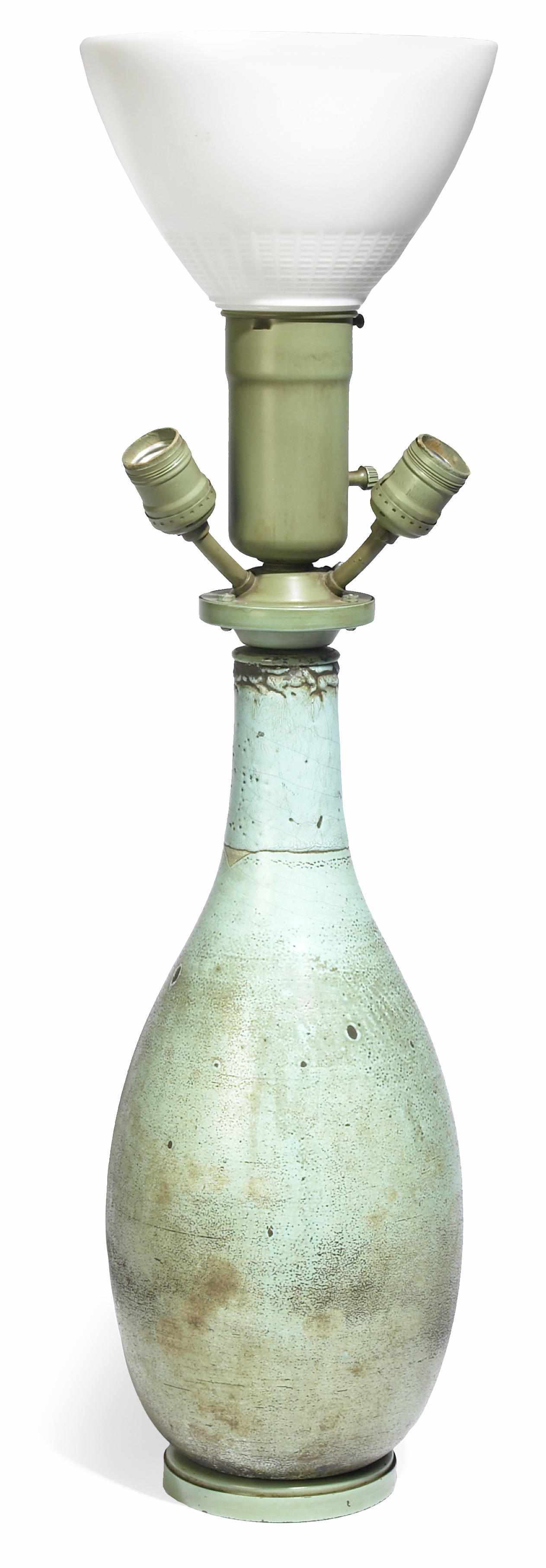 Appraisal: A French glazed earthenware vase mounted as a lamp vase