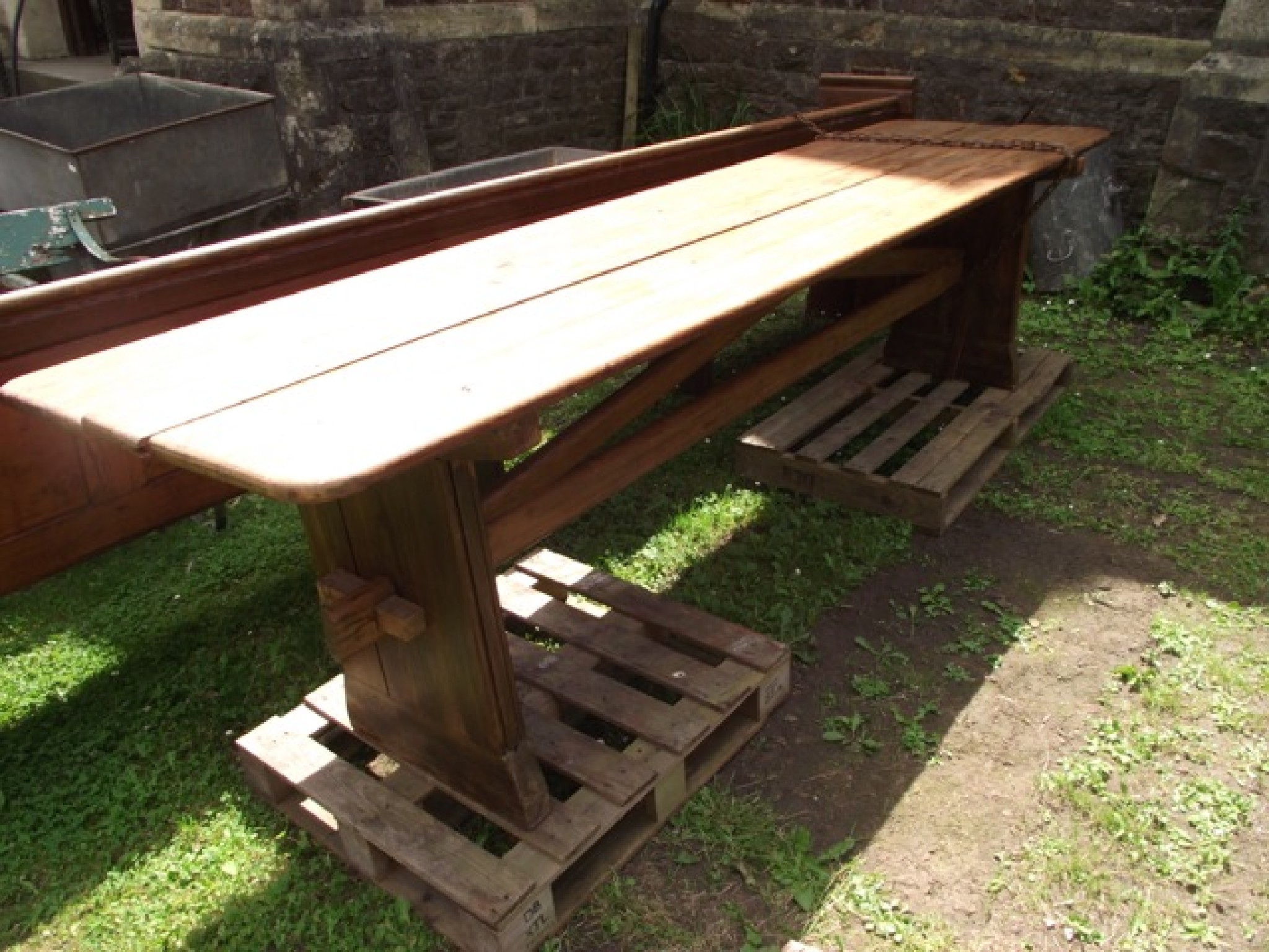 Appraisal: A pitch pine refectory table the rectangular boarded top with