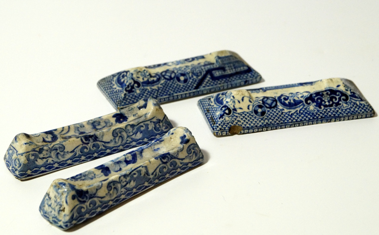 Appraisal: Two pairs of thC blue and white pottery knife rests