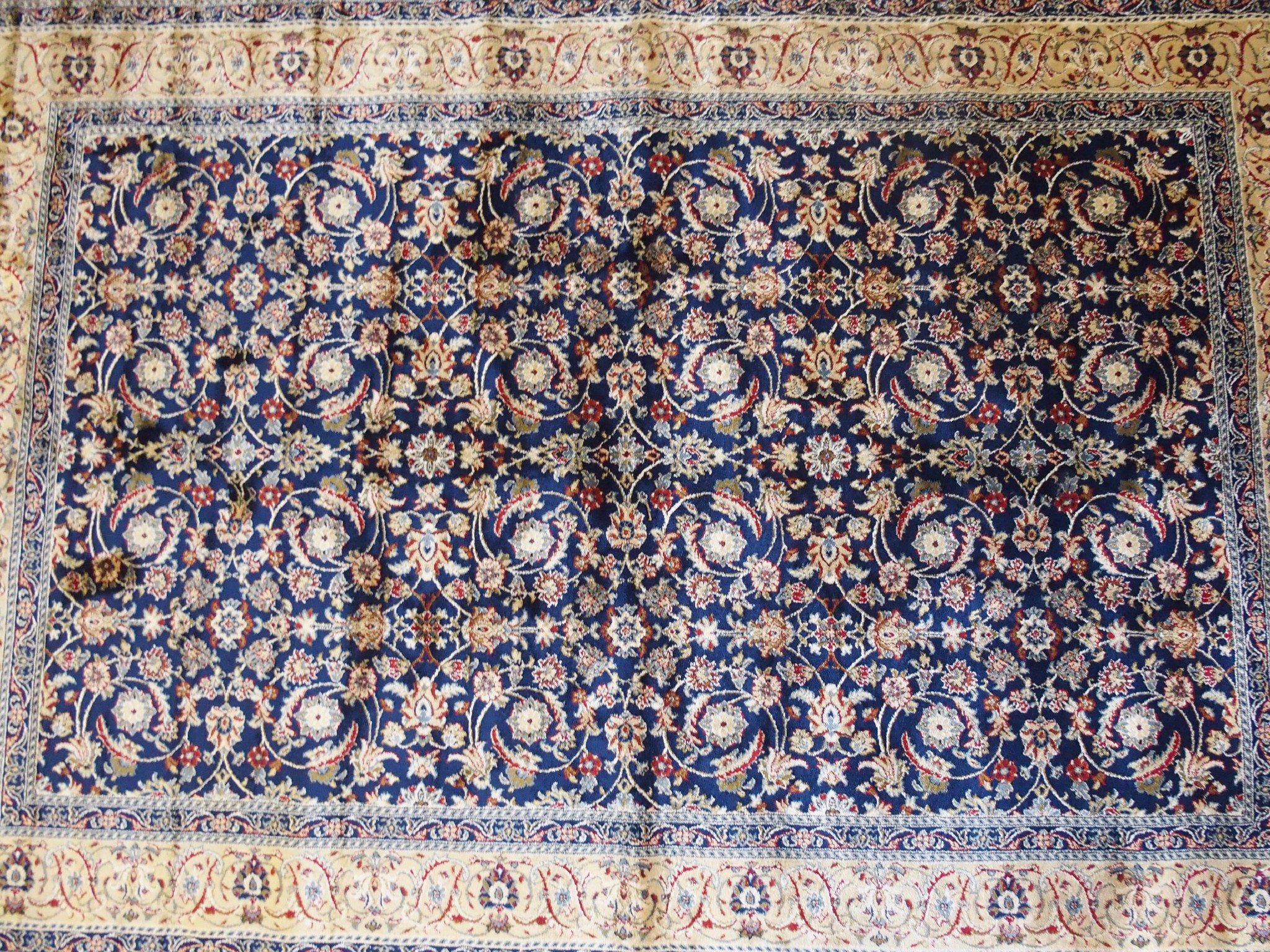 Appraisal: A Kashmir silk rugthe blue ground with repetitive foliate scroll