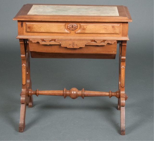 Appraisal: Victorian Walnut Sewing Table Marble inset top with two drawers