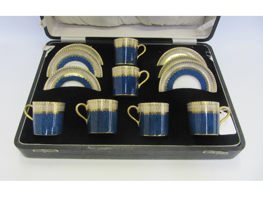 Appraisal: Cased Aynsley China coffee cans and saucers with blue and