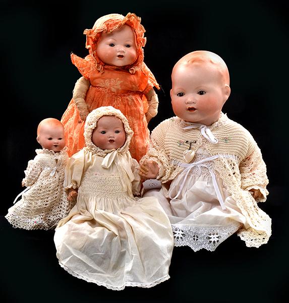 Appraisal: FOUR ARMAND MARSEILLE BISQUE HEAD BABY DOLLS all open mouths