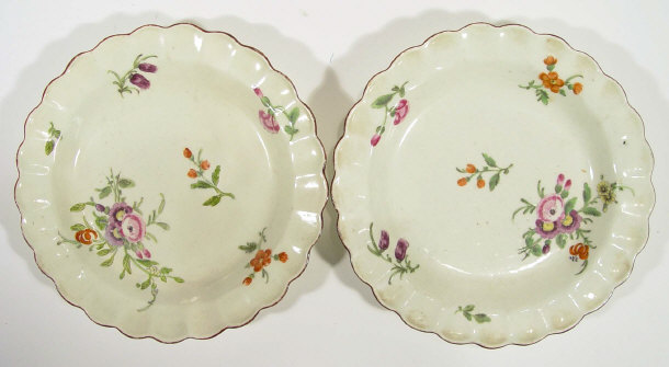 Appraisal: Two th Century pottery dishes hand painted with flowers cm