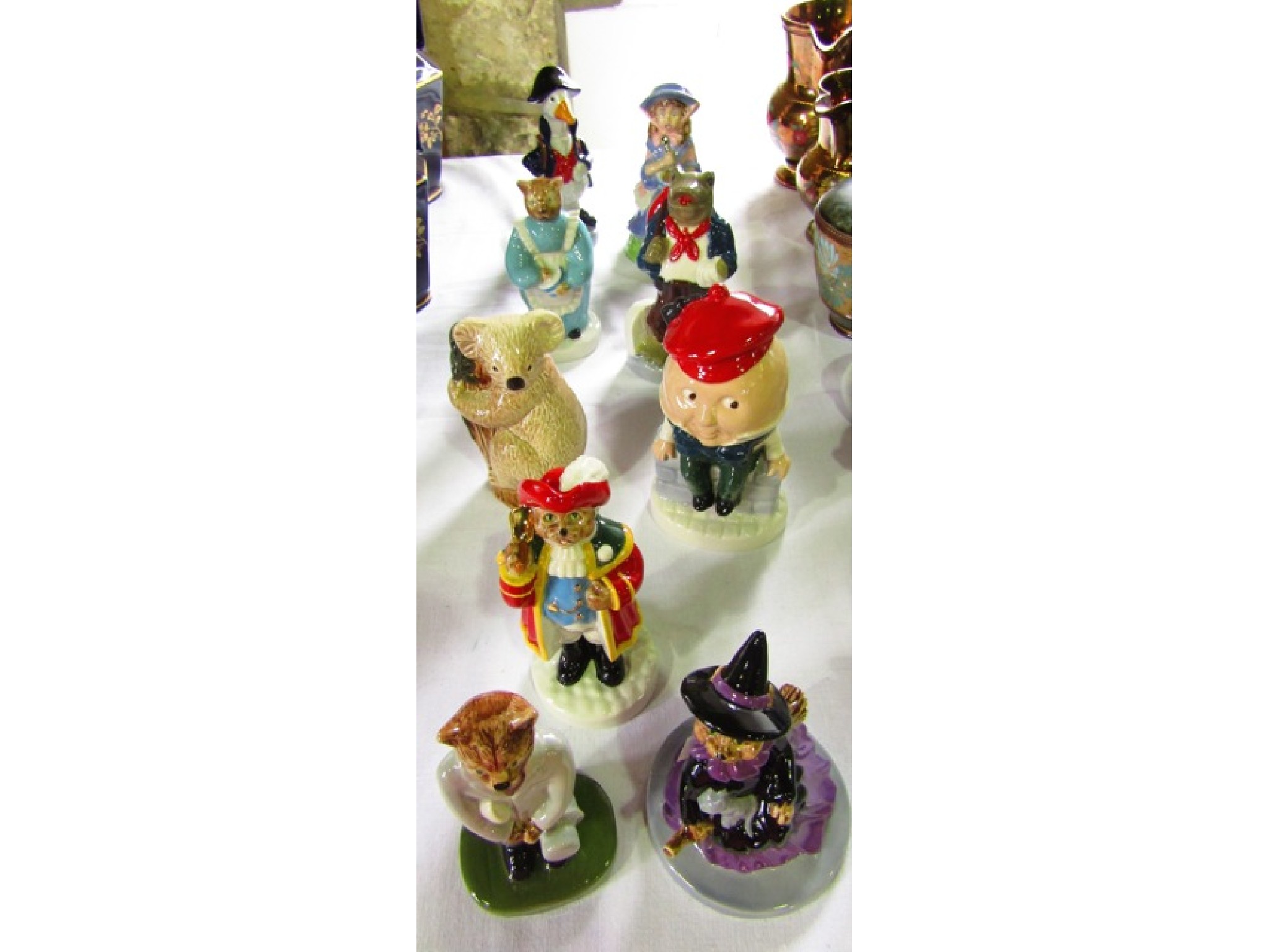 Appraisal: A collection of nine Wade figures including Town Crier Catkin