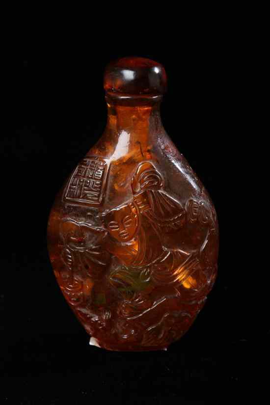 Appraisal: CHINESE AMBER SNUFF BOTTLE Flattened ovoid-form carved with figural decoration