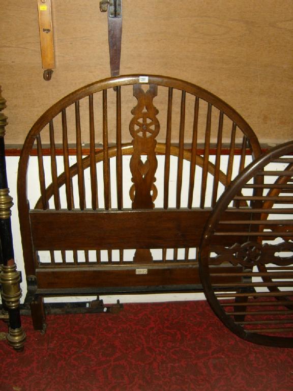 Appraisal: A pair of oak hoop and stick back single bedsteads