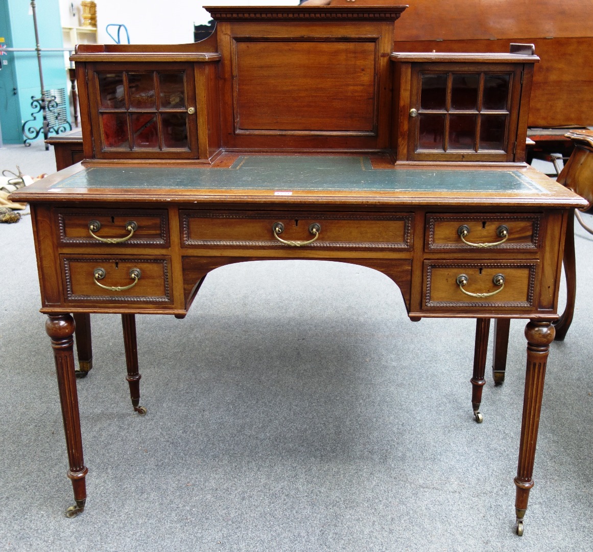 Appraisal: A late th century mahogany writing desk with a pair