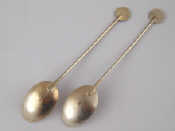 Appraisal: A pair of modern silver teaspoons with disc ends maker