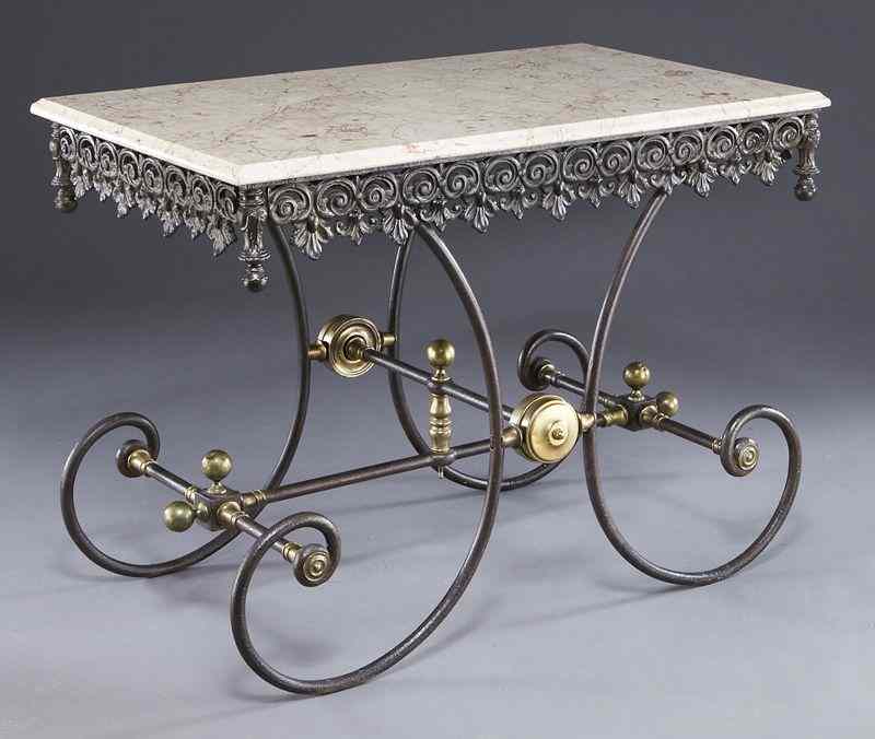 Appraisal: French cast iron and marble top pastry tablehaving a bellflower