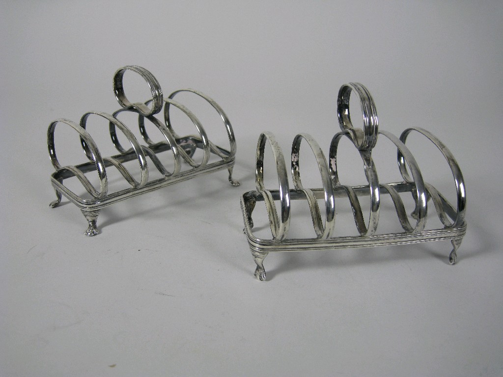 Appraisal: Pair of Edward VII five bar Toast Racks on paw