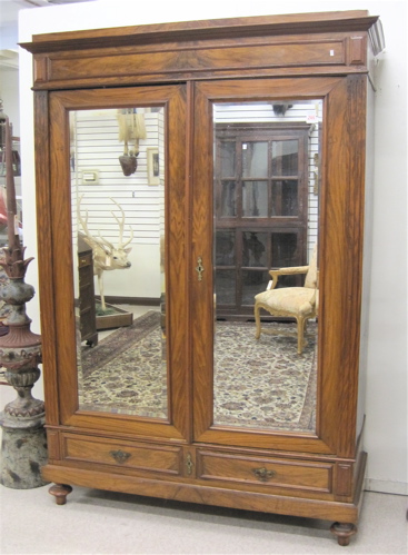 Appraisal: TWO-DOOR WALNUT WARDROBE Continental c having a molded flat-top cornice