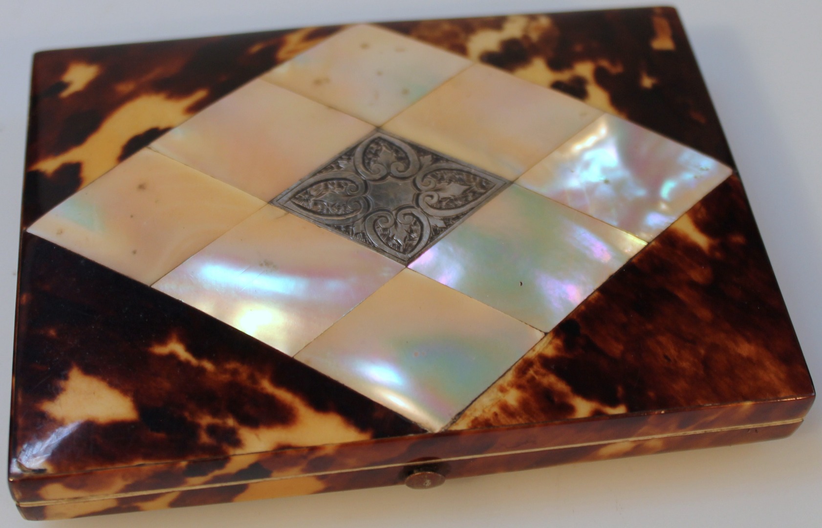 Appraisal: A Victorian tortoiseshell mother of pearl and white metal card