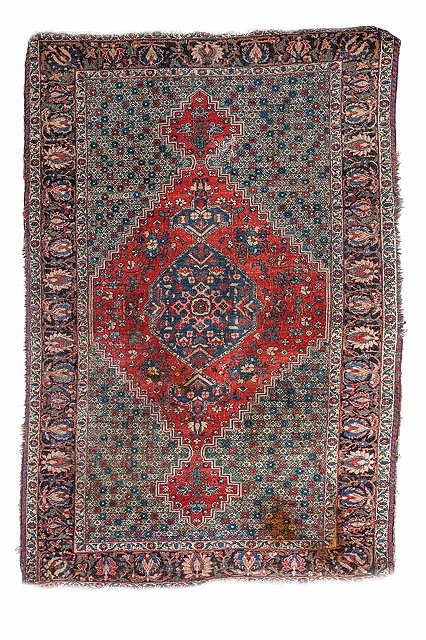 Appraisal: A BAKTIARI RED GROUND RUG with central medallion within a