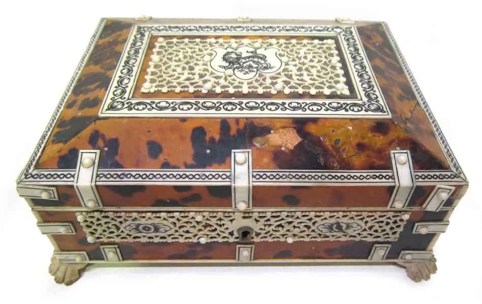 Appraisal: A TORTOISE SHELL AND IVORY STYLE CASKET WITH BLACK STAIN