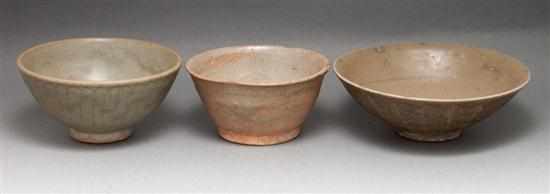 Appraisal: Three Chinese celadon glaze stoneware and earthenware bowls th- th