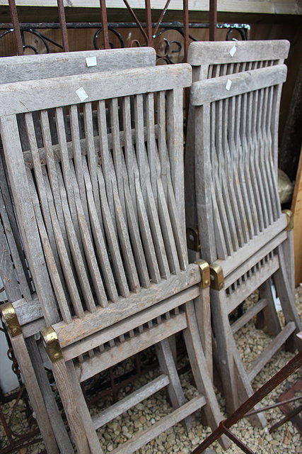 Appraisal: FOUR TEAK HEART OF ENGLAND FOLDING GARDEN CHAIRS